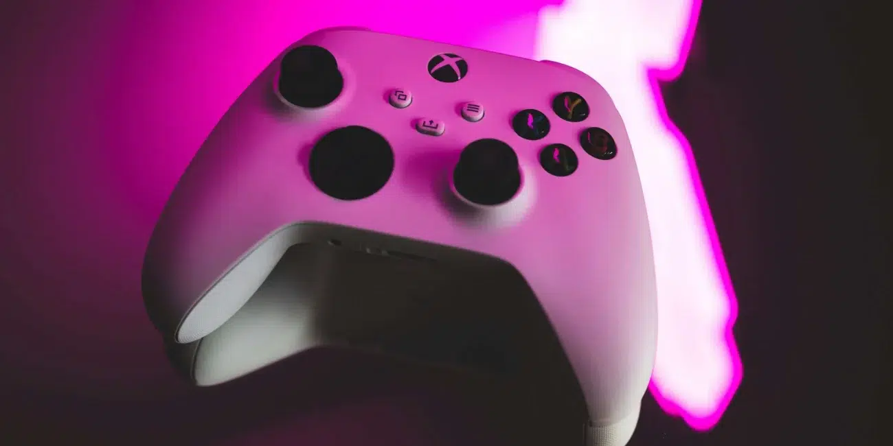 Xbox controller with a pink glowing light on it